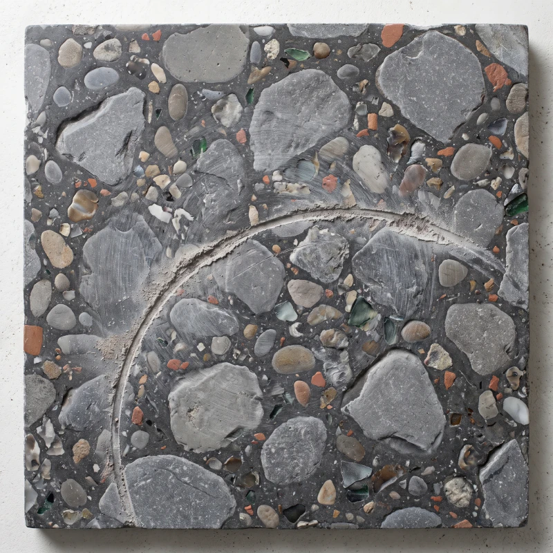 Large grey stone chips in a dark cement