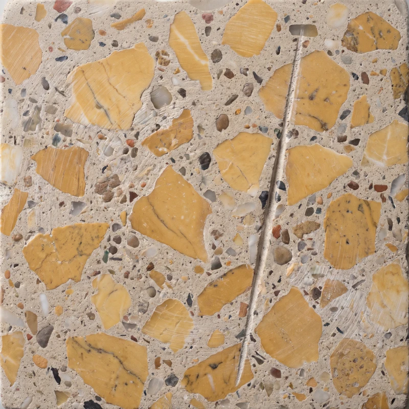 Yellow ochre chip in a sand coloured cement